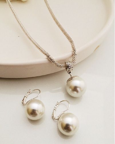 ست بدلیجات رولباسى مرواويدى زنانه Tosh