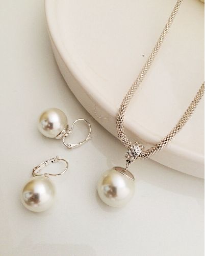 ست بدلیجات رولباسى مرواويدى زنانه Tosh